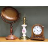 An oak mantel clock plus a brass and porcelain candlestick