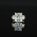 An impressive platinum solitaire diamond ring, the princess cut diamond approx 6cts,