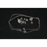 Three pairs of silver earrings including diamond set pair and a silver necklace