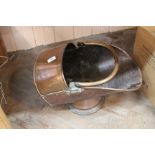 A 19th Century copper helmet coal scuttle