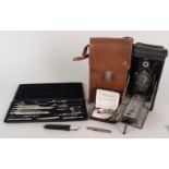 A cased vintage Kodak camera, silver body pen knife, cufflinks,