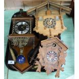 A German and a Swiss cuckoo clock plus another continental wall clock