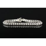 A white metal diamond bracelet consisting of forty three diamonds (estimated 2ct total weight)