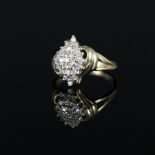 A 9ct gold diamond cluster ring in marquise shaped setting with curved shoulders,