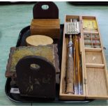 A collection of wooden boxes a bookslide bookends and a cased fishing rod with flies