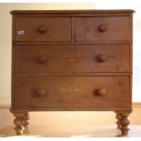 A mid 19th Century stripped pine two drawer cottage chest