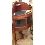 An early 19th Century corner washstand with added glazed doors