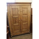 A 19th Century continental pine two door "knock down" wardrobe