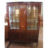 An Edwardian mahogany four door display cabinet