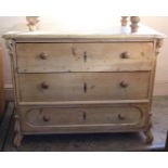 A 19th Century continental pine three drawer chest on carved shaped feet