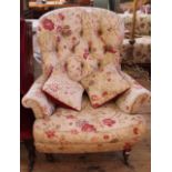 A mid 19th Century style button back armchair in floral upholstery