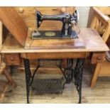 A Singer sewing machine on treadle base