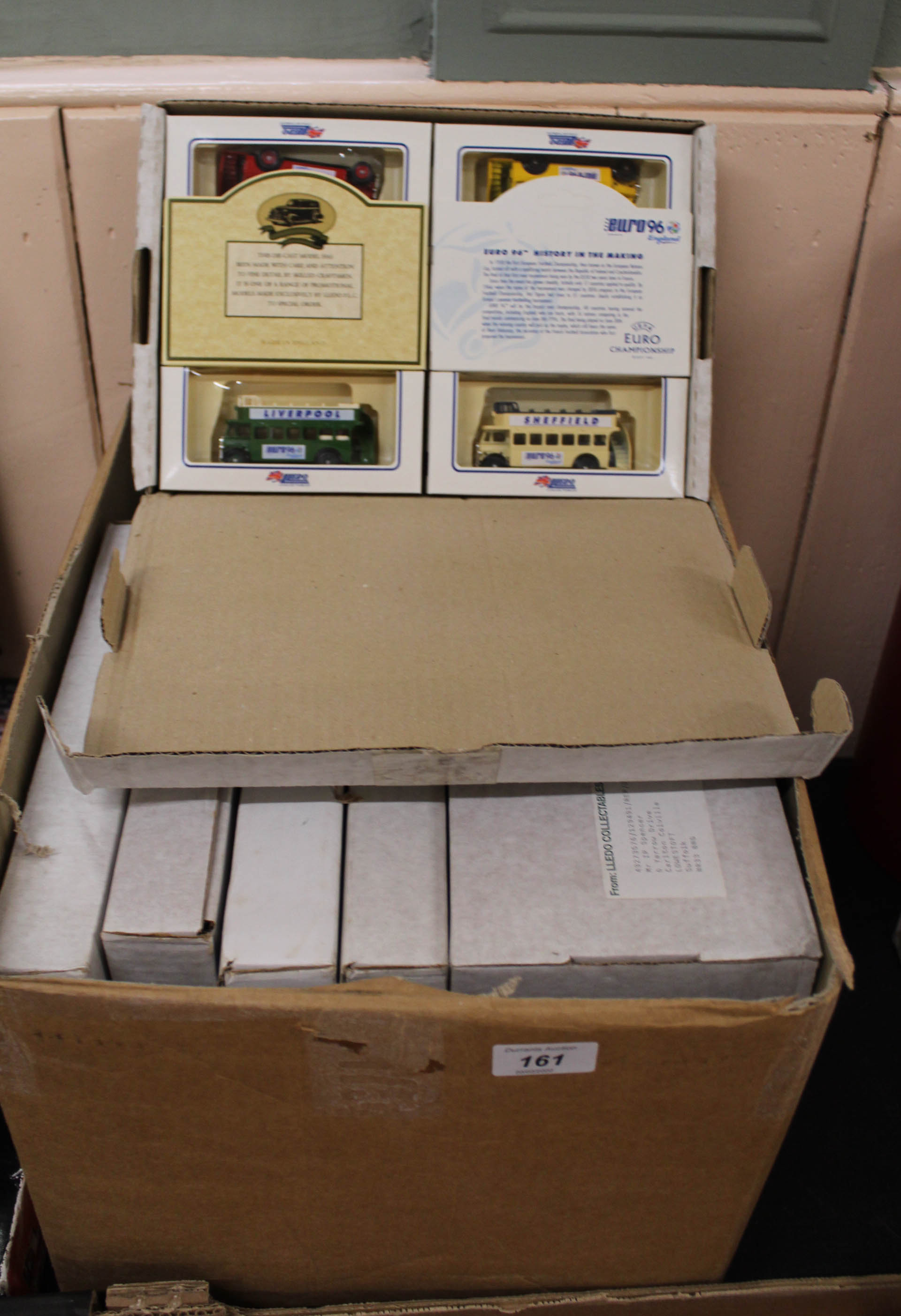 A box containing a collection of Lledo model car and lorry sets