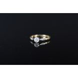 An 18ct gold and platinum diamond solitaire ring, approx 0.