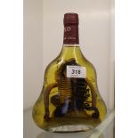 A bottle of XO fire spirit containing a cobra and a scorpion, (not for consumption,