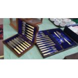 Two cased sets of six engraved silver plated fish knives and forks,
