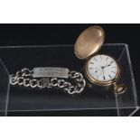 A gold plated Elgin hunter pocket watch and silver ID bracelet