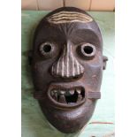 A Pende carved wooden tribal mask from the Congo