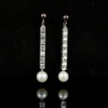 A pair of precious metal diamond and pearl drop earrings,