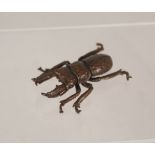 A bronze stag beetle,