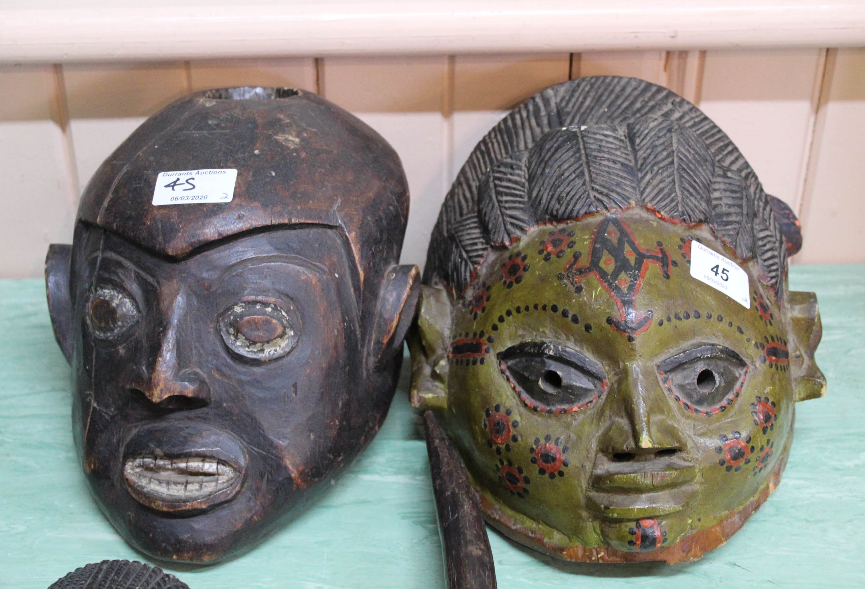 Two West African masks, one Yoruba,