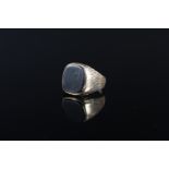 A gents signet ring set with onyx stone,