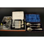 Three silver spoons, a boxed silver plated fruit set,