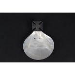 An unusual silver handled mother of pearl baptism dish, the silver handled in cross form,