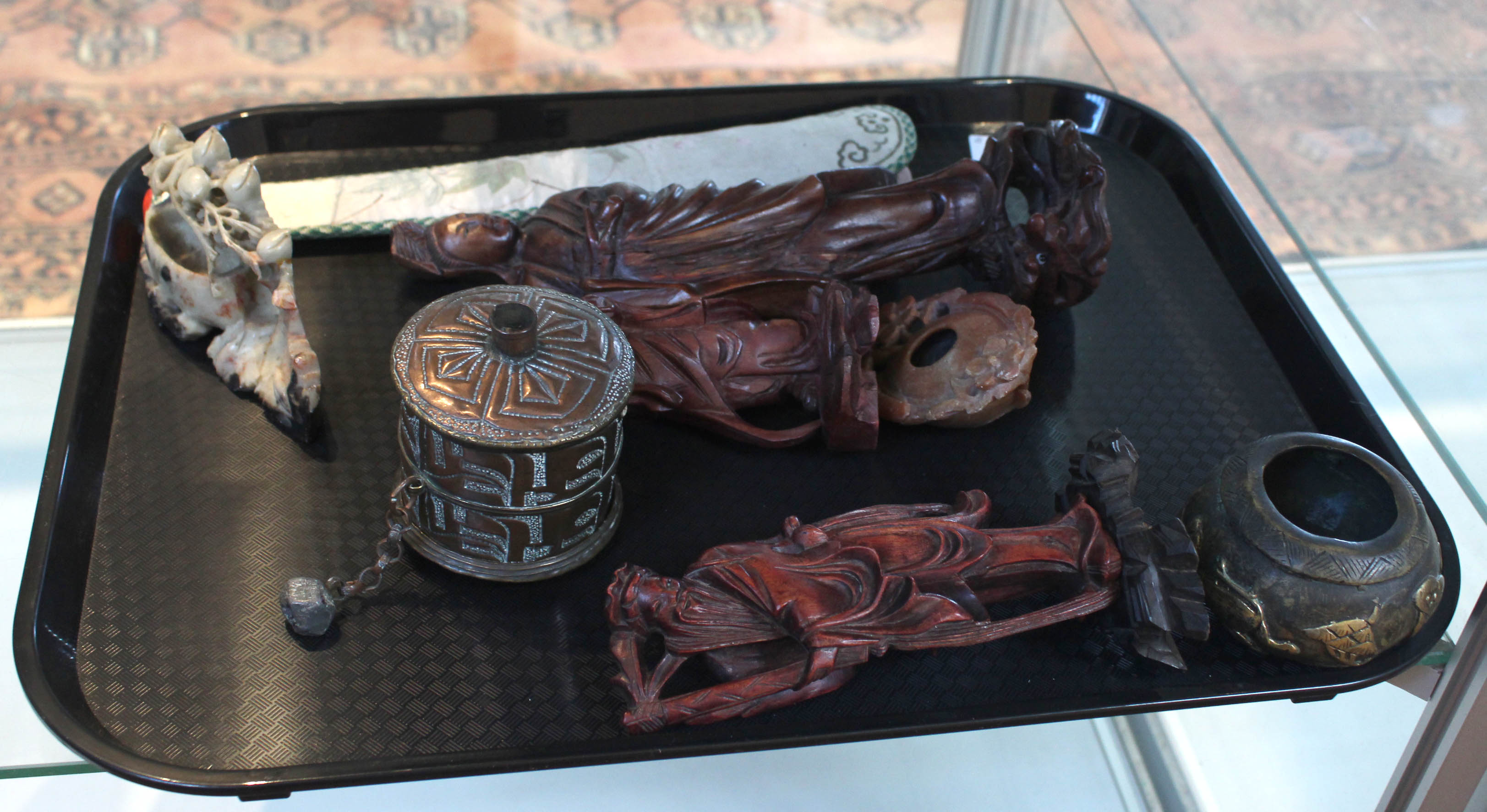 Three Chinese carved figures, a fan case,