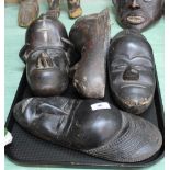Four West African wall masks with aluminium inlay,