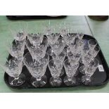 A matching set of cut glass drinking glasses including wine, sherry,