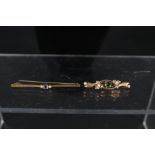 A 9ct gold bar brooch together with a 15ct gold bar brooch set with sapphire