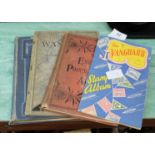 Four assorted stamp albums containing world stamps