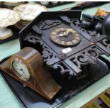 A Swiss carved wooden cuckoo clock plus a small inlaid mantel clock