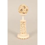 An ivory puzzle ball on stand,