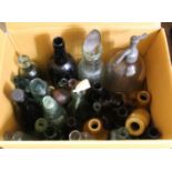 A box of collectors glass and stoneware bottles