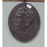 A 19th Century oval bronze plaque of a male head in profile, possibly French,