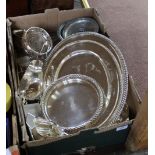A mixed lot of silver plate including large plates, sauce boats, bottle coasters,