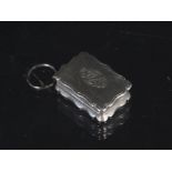 A Victorian silver vinaigrette with engraved decoration, monogram to lid,