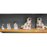 A pair of Staffordshire dogs plus a Staffordshire figurine,