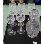 A tray of eight cut glass hock glasses with engraved vine leaves to bowls plus a cut glass decanter
