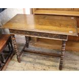 An early 20th Century oak bobbin turned writing table with single drawer