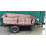 A vintage pine and metal car trailer