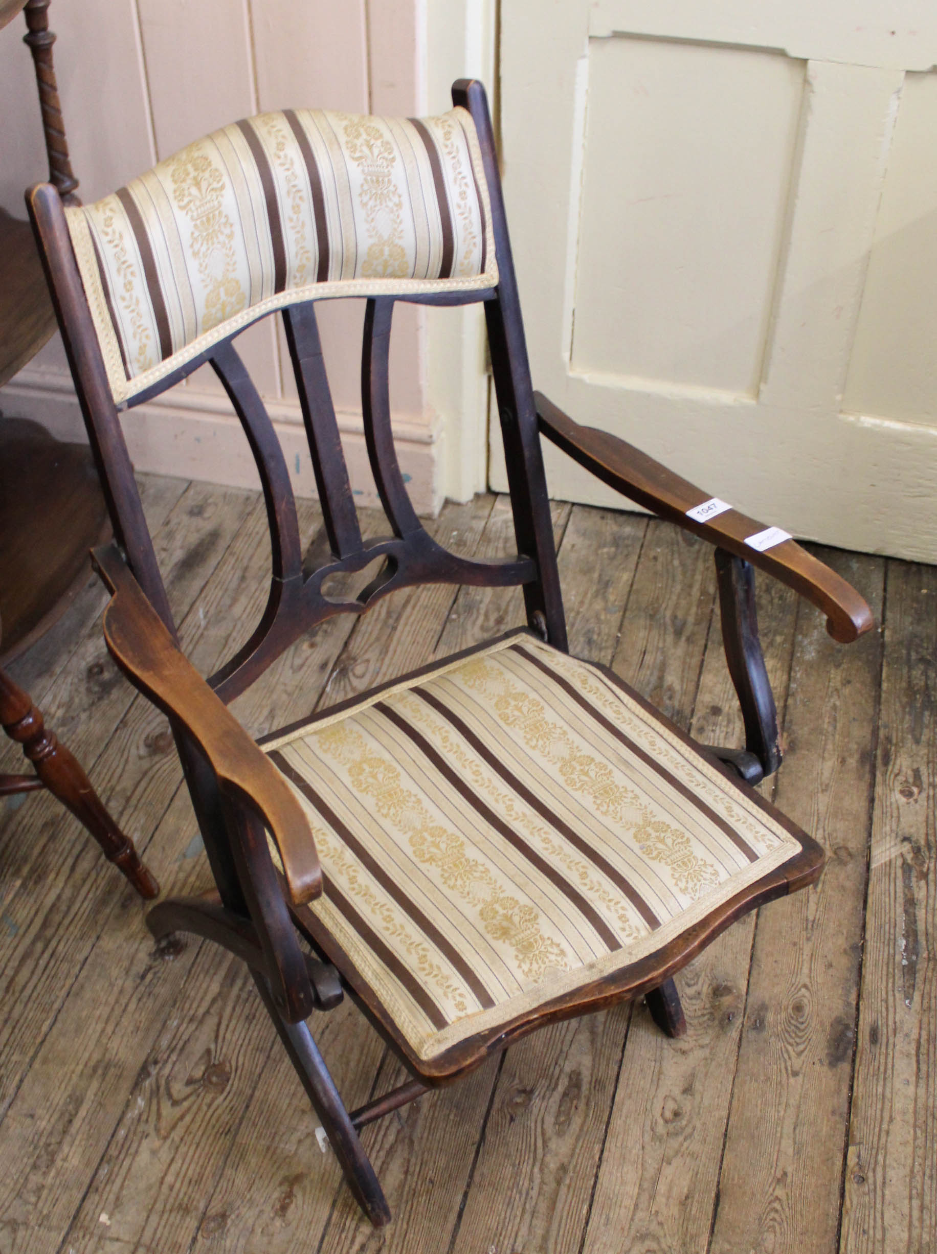 An early 20th Century folding mahogany chair