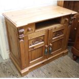 A late 20th Century pine two door cupboard