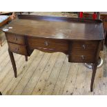 A late 20th Century Regency style mahogany five drawer dressing table