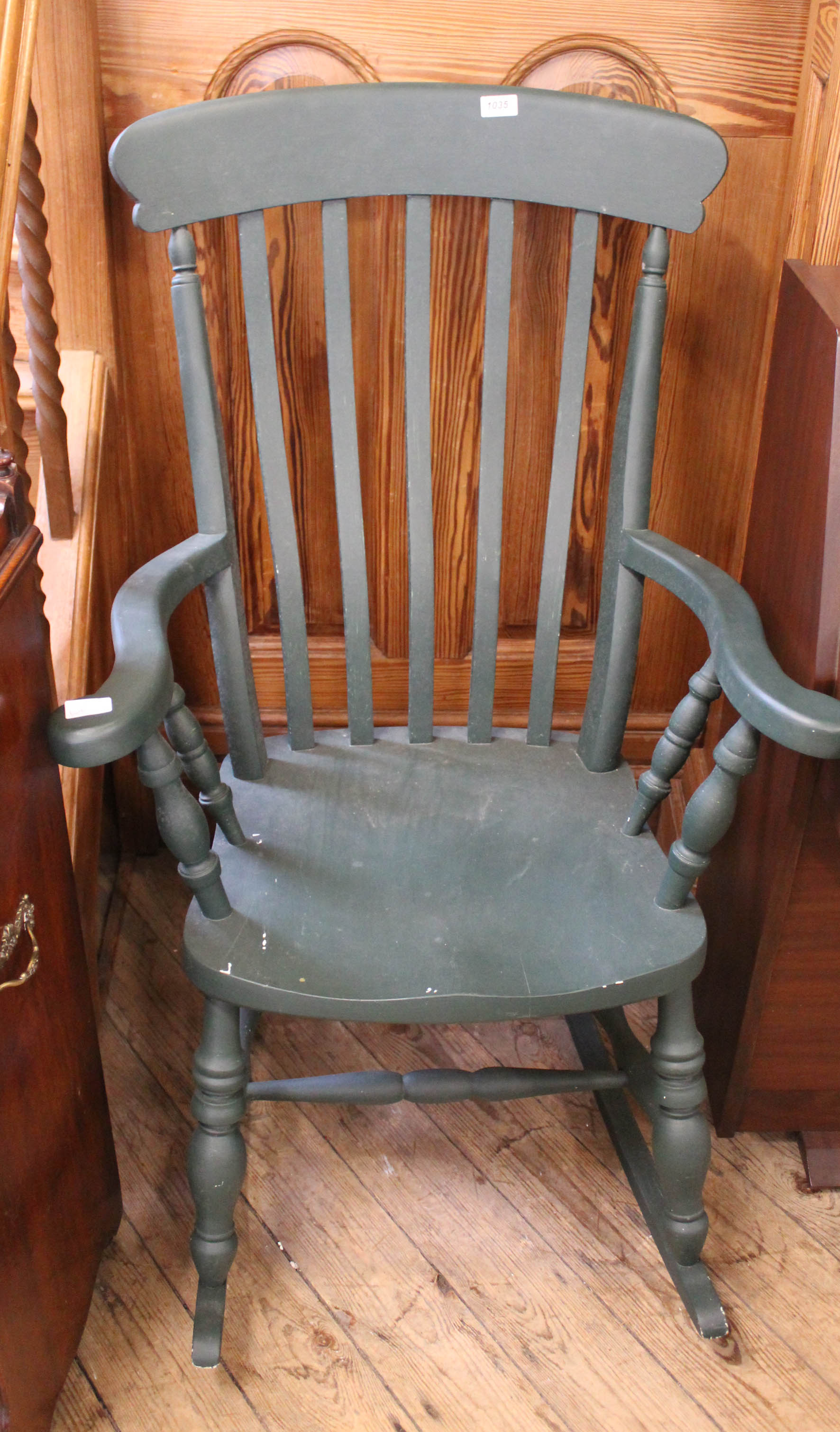 A late 20th Century painted beech rocking chair