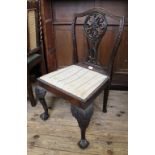 A late 18th Century carved mahogany dining chair with cabriole legs and ball and claw feet