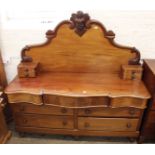 A mid Victorian mahogany eleven drawer sideboard with carved mahogany upstand