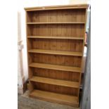A late 20th Century stained pine bookcase with five shelves